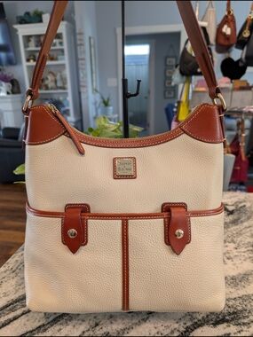 Dooney & Bourke Pebbled Leather Shoulder Bag w/Front Snap Pockets Zip Closure